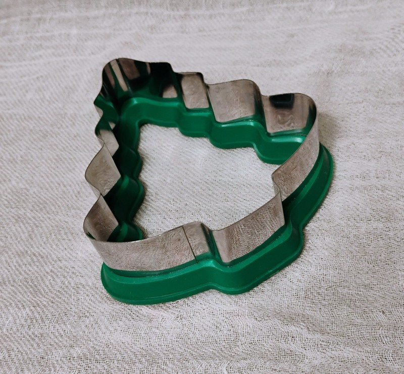 Two Wilton comfort-grip cookie cutters, blue snowflake and green Christmas tree. gallery