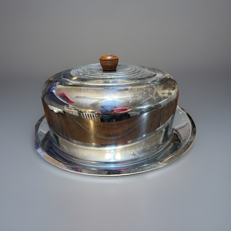 Vintage mid-century chrome cake dome with matching serving plate.