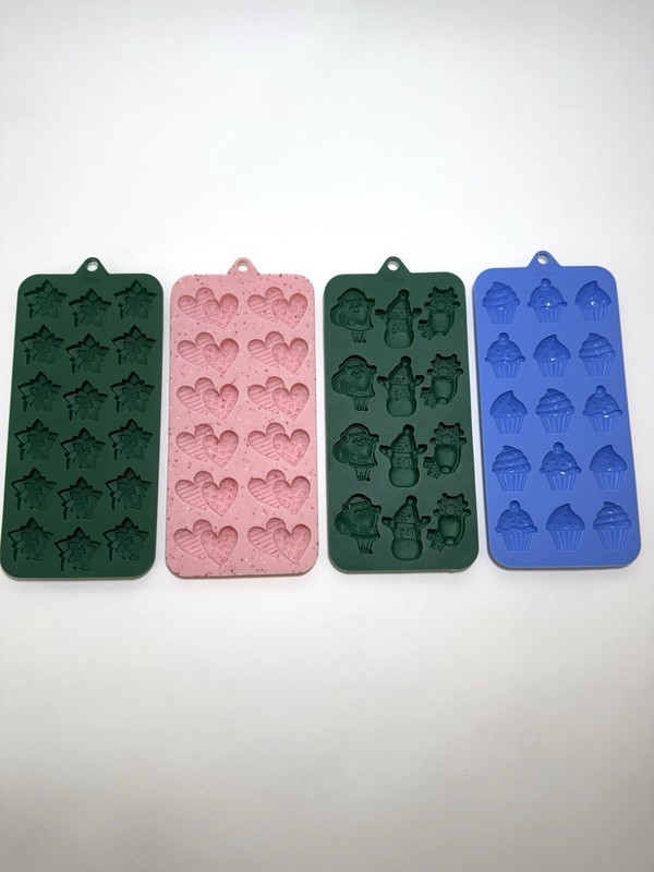 Four Wilton Silicone Candy Molds Hearts, Cupcakes, Stars, Holiday
