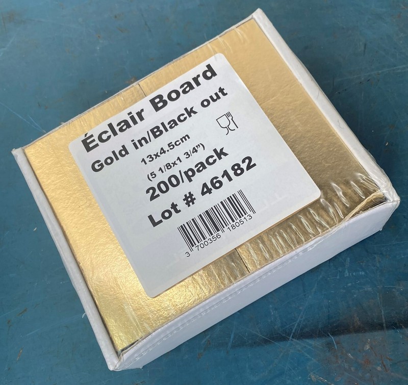 ECLAIR BOARD BLACK & GOLD 5-1/8″ X 1-1/3″ X1/2″ SOLID CARDBOARD GOLD LAMINATED
