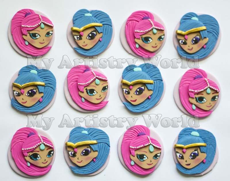 A set of twelve edible Shimmer and Shine themed cupcake toppers.