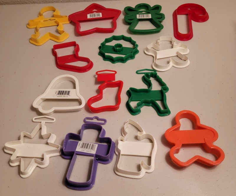 Vintage assortment of 14 new plastic Wilton Christmas cookie cutters.