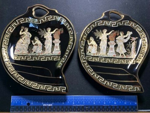 Two Skratimenos 24K Gold design on black decorative leaf shape dishes