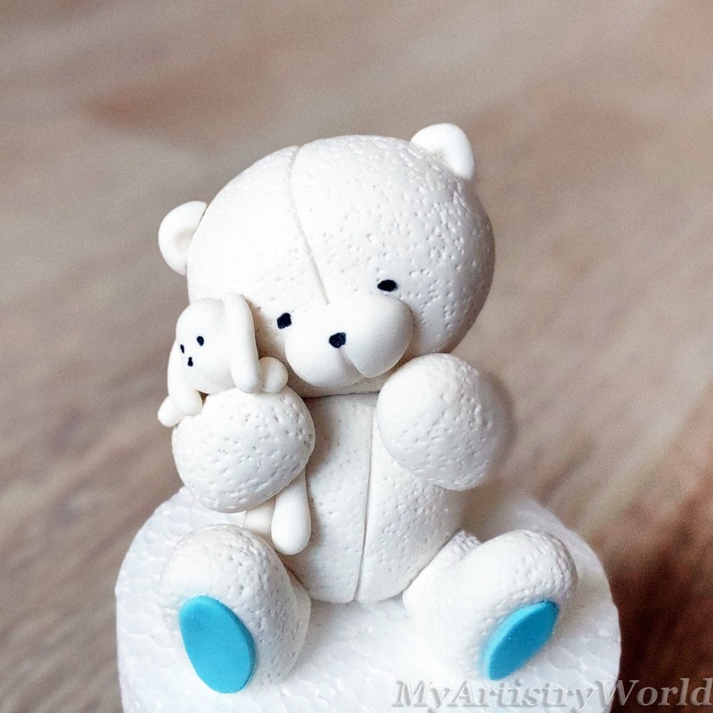 Bear holding a toy hare cake topper. Edible 3D fondant/gum paste Bear with bunny