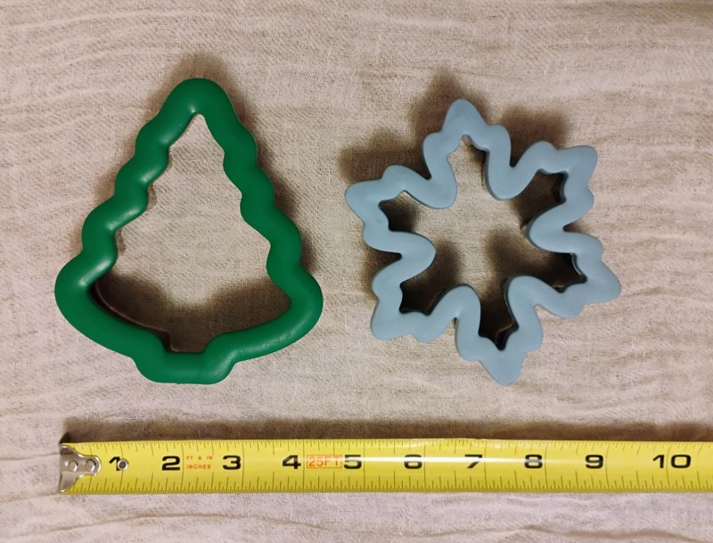 Two Wilton comfort-grip cookie cutters, blue snowflake and green Christmas tree. gallery