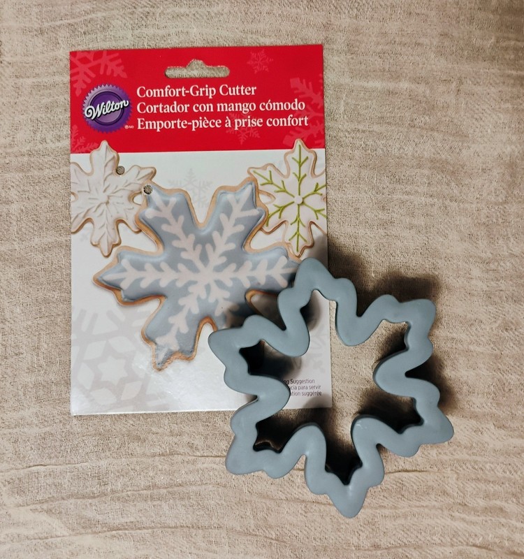 Two Wilton comfort-grip cookie cutters, blue snowflake and green Christmas tree. gallery