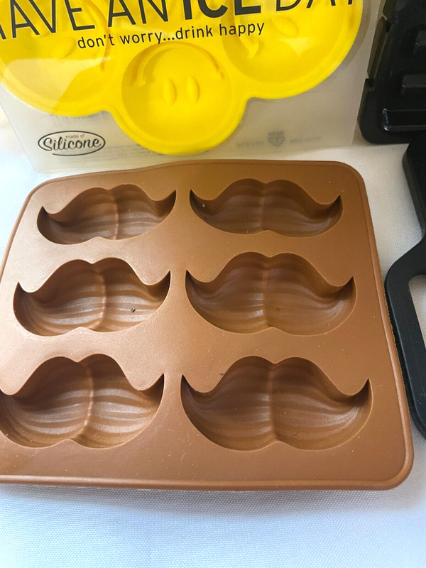 Lot of Silicone Bullet, handgun, mustache, Smiley Ice Chocolate Soap Tray gallery