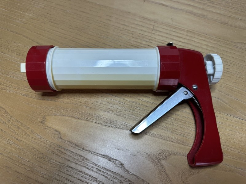 Vintage Ronco cookie press red and white metal mechanism