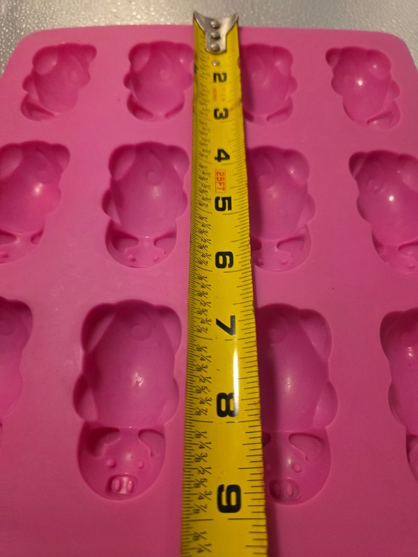 This is a pink Mobi 12 Little Pigs in a Blanket Silicone Baking Mold. gallery