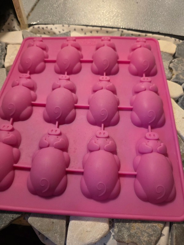 This is a pink Mobi 12 Little Pigs in a Blanket Silicone Baking Mold. gallery