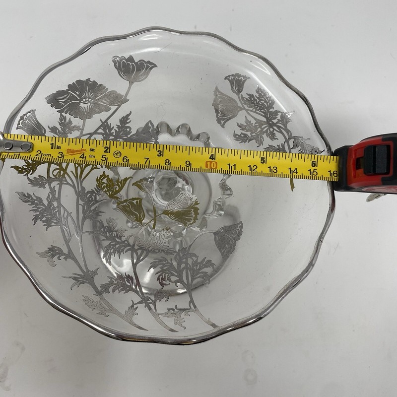 Clear glass pedestal stand with silver trim and silver flower accents gallery