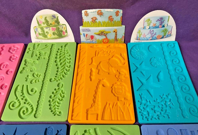 Wilton Silicone fondant molds space water leaves jungle shells buttons Lot of 8 gallery