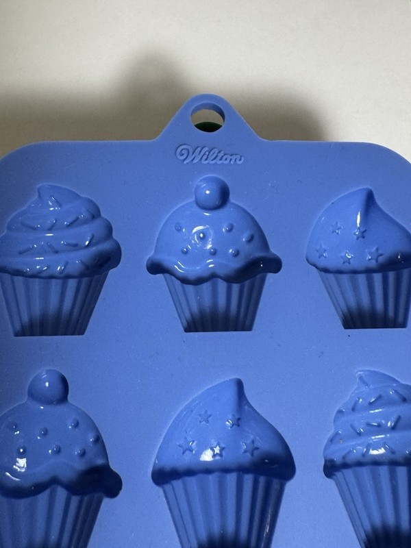 Four Wilton Silicone Candy Molds Hearts, Cupcakes, Stars, Holiday gallery