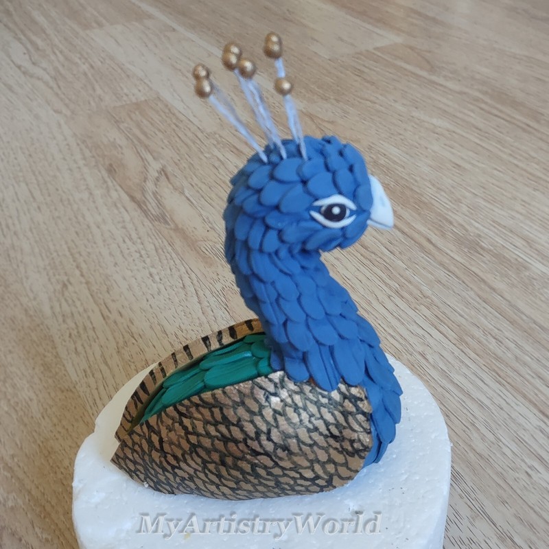 Edible Peacock cake topper. No tail included, it can be ordered separately!