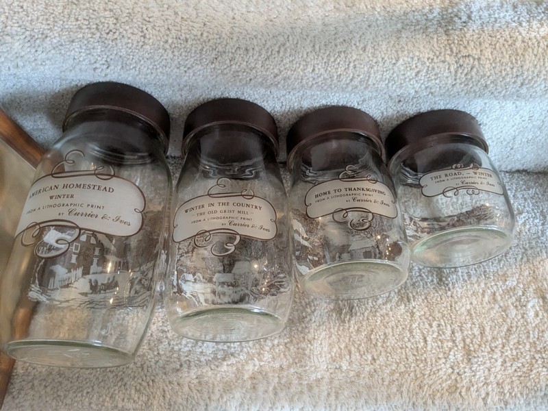 Currier and Ives four piece lithograph baking jar set, one cracked lid