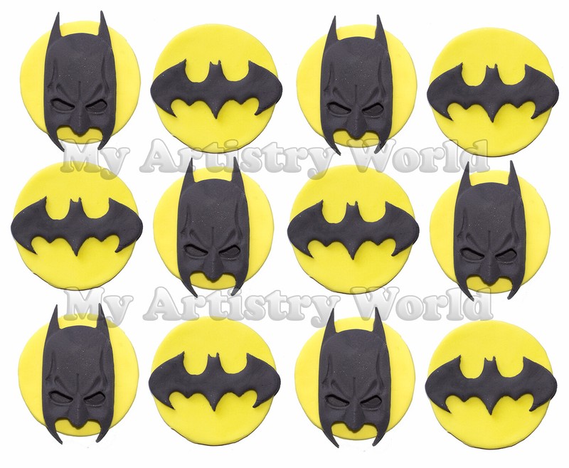 A set of twelve edible cupcake toppers with Batman masks and logo.