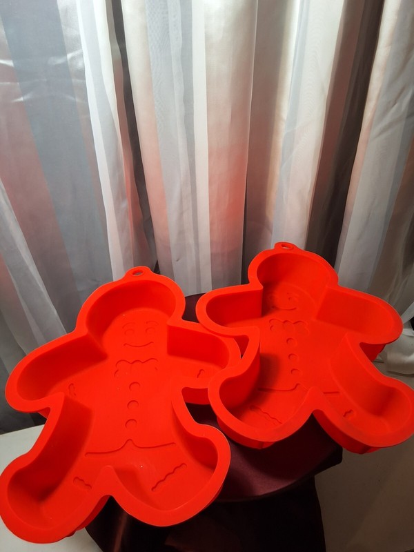 2 GINGERBREAD MEN SILICONE MOLDS, RED PREOWNED, NEVER USED