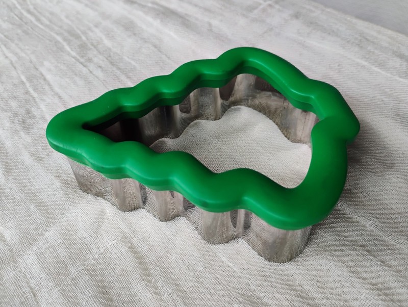 Two Wilton comfort-grip cookie cutters, blue snowflake and green Christmas tree. gallery