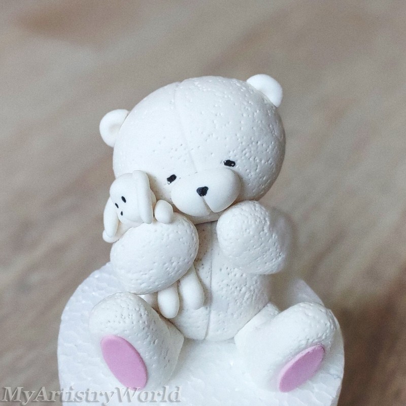 Bear holding a toy hare cake topper. Edible 3D fondant/gum paste Bear with bunny