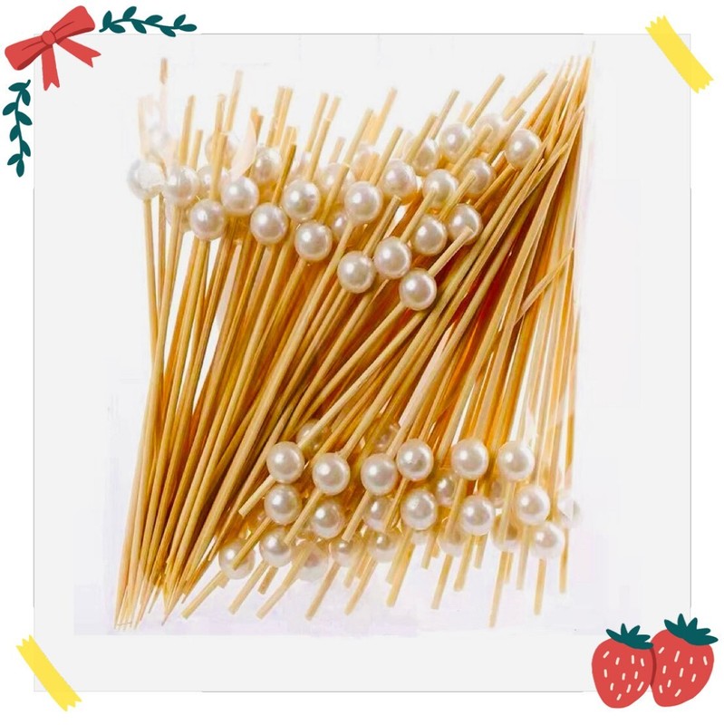 Wooden picks with decorative, silver pearls for baking, appetizers and cocktails