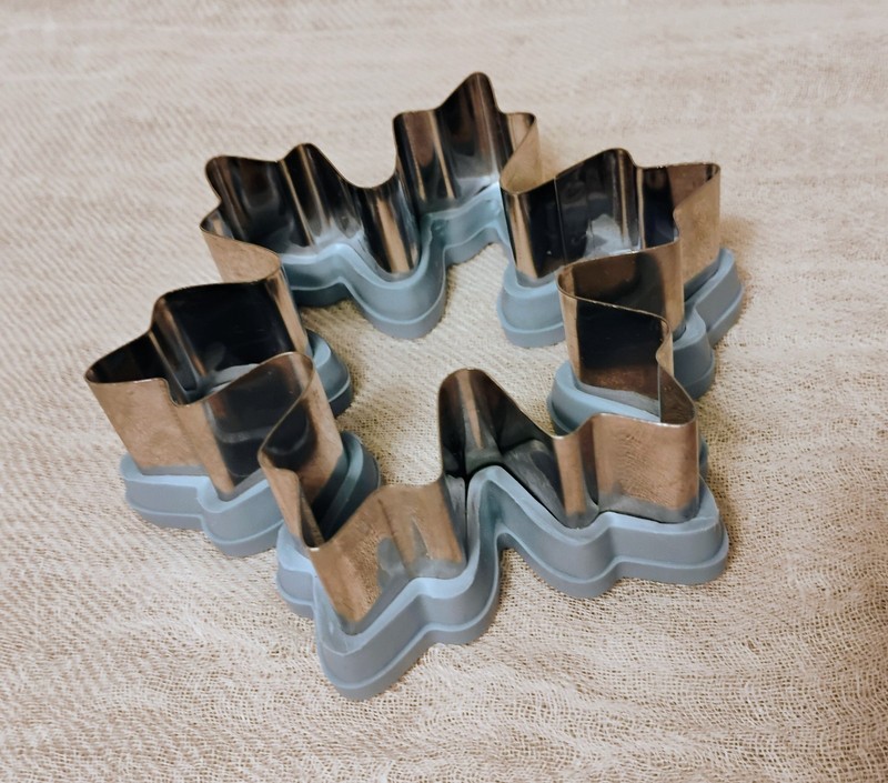 Two Wilton comfort-grip cookie cutters, blue snowflake and green Christmas tree. gallery