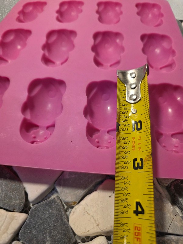 This is a pink Mobi 12 Little Pigs in a Blanket Silicone Baking Mold. gallery