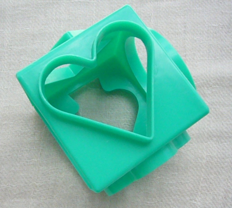 Ace Biscuit Cutter – aqua cube w/ heart, diamond, spade, club, circle, square.