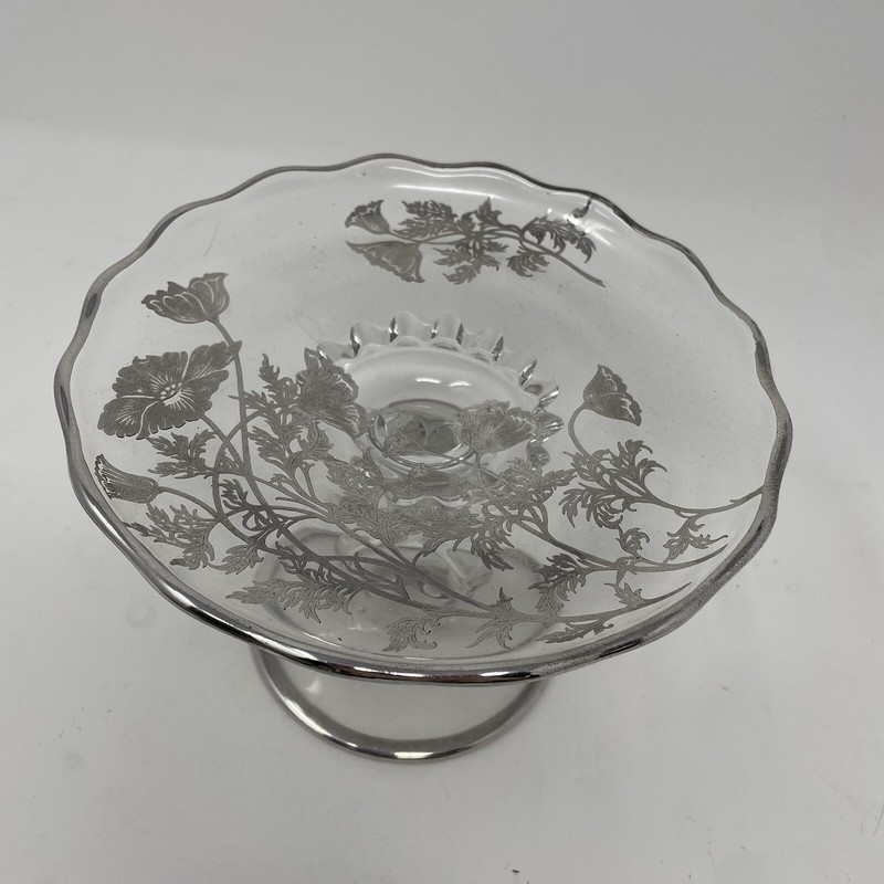 Clear glass pedestal stand with silver trim and silver flower accents gallery