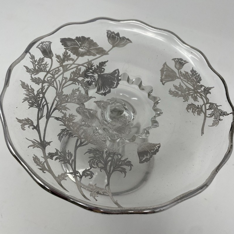 Clear glass pedestal stand with silver trim and silver flower accents gallery