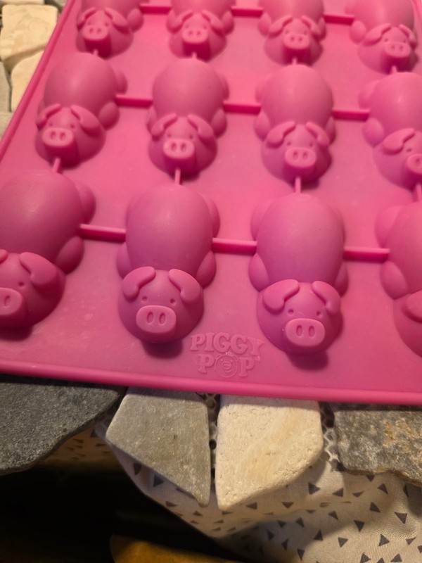 This is a pink Mobi 12 Little Pigs in a Blanket Silicone Baking Mold. gallery